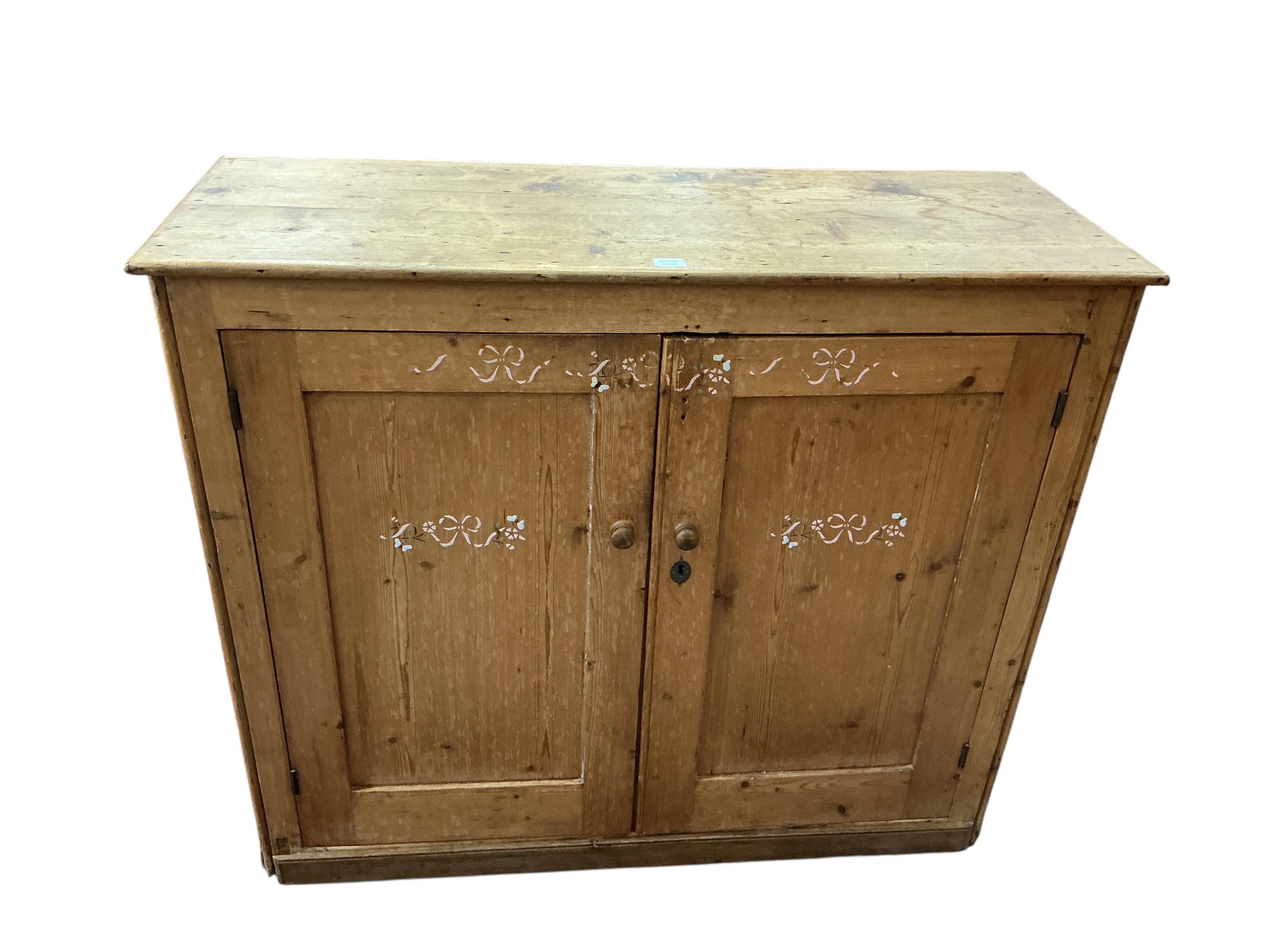 A Victorian pine side cabinet, width 131cm, depth 49cm, height 111cm